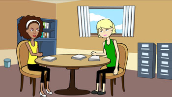 Justyce and Allison sitting at a table in an office