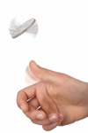 photo of a hand flipping a coin